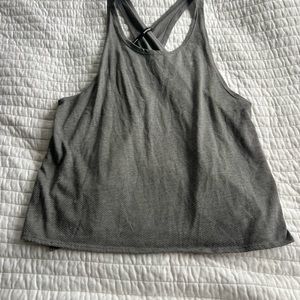 Woman’s Nike gray running tank with an open back (size M)